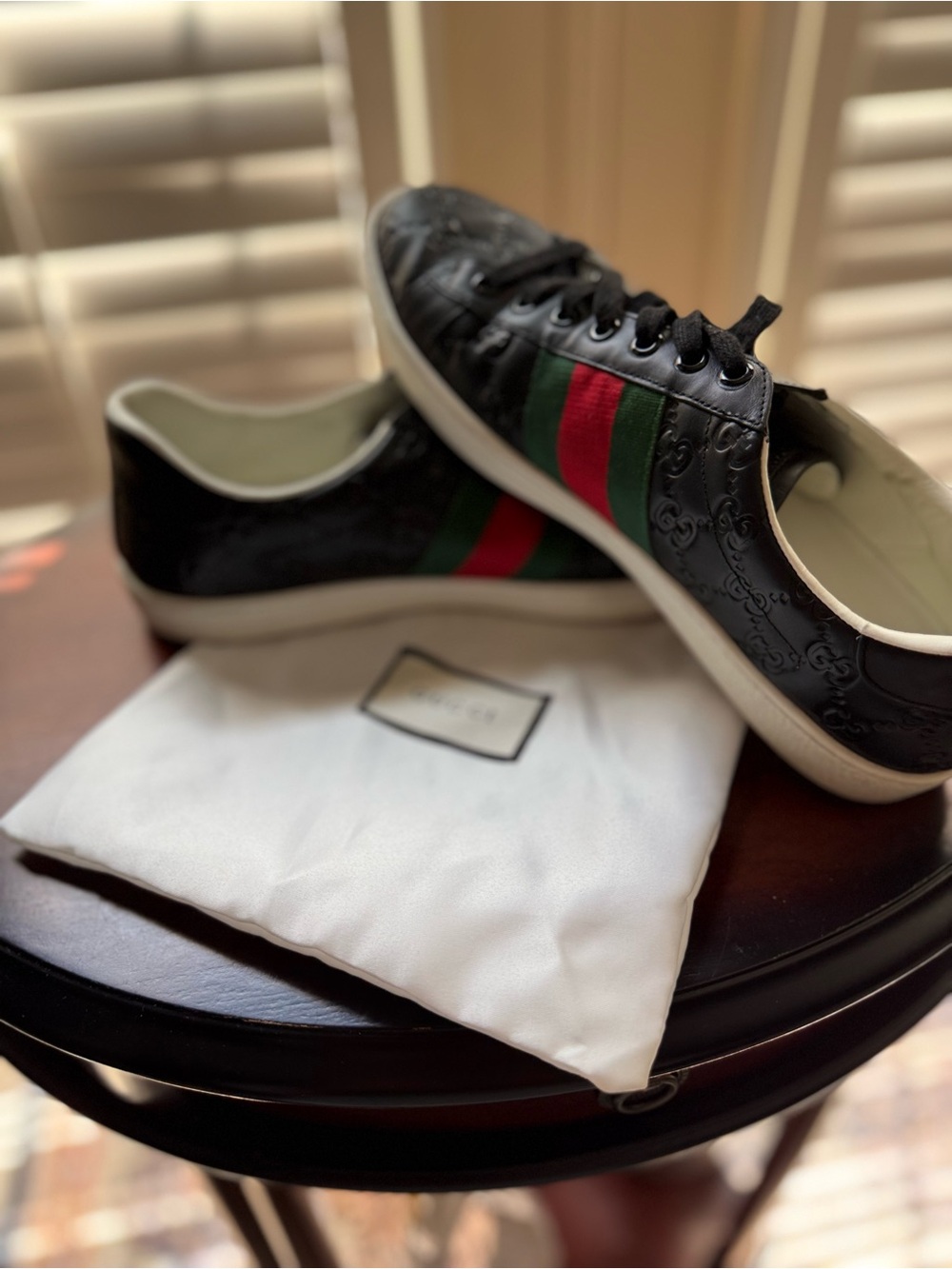 Gucci Ace “GG Supreme” in black leather- with embossed monogram